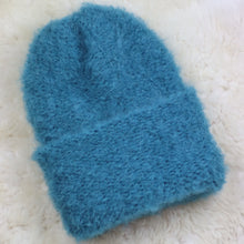 Load image into Gallery viewer, A furry hat with a twist brim
