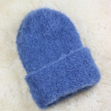 Load image into Gallery viewer, A furry hat with a twist brim